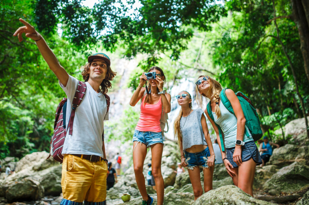 Group of Tourists Exploring The Jungle